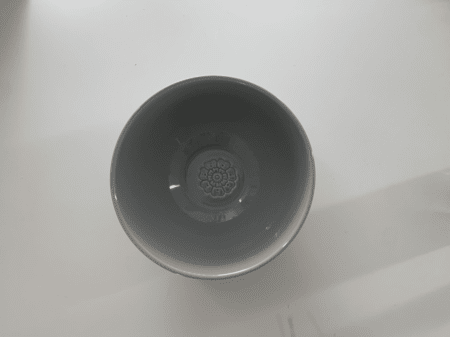 <b>Bowl Top</b><br> I photographed the top of the bowl with my phone, showing the size of the opening and the overall silhouette. I chose this object because it is a simple semicircle with unique printed details on the surface.