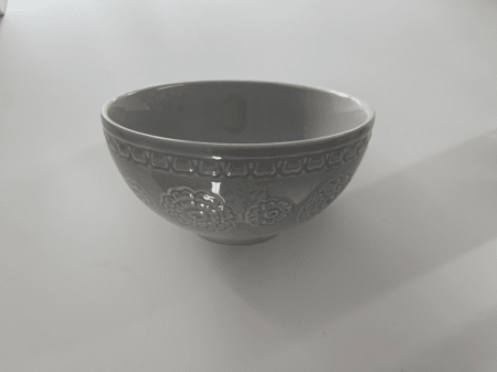 <b>Bowl Front</b><br> I used my phone to capture the front of the bowl, highlighting the carved patterns and artistry. I chose this object because it is a simple semicircle with unique printed details on the surface.