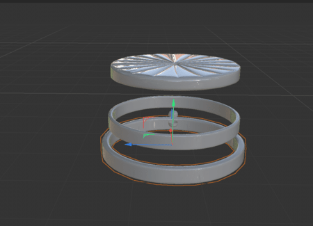 <b>Orange round object parts</b><br>In this Cinema 4D model, I created a simple model showing parts of a round object. The top part has a star pattern, while the rings below are smooth and fit together. This setup helps me understand how the pieces connect.
