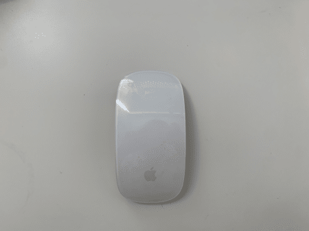 <b>Magic Mouse Front</b><br> I used my phone to capture the front of the Magic Mouse, highlighting its streamlined design and minimalist appearance. I chose this object because it is a complex item with a streamlined design.