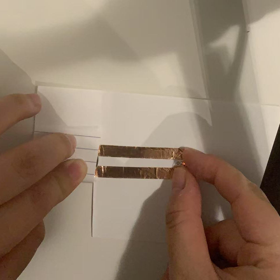 I pressed the components together in my completed circuit. The LED glowed, proving my design was successful.