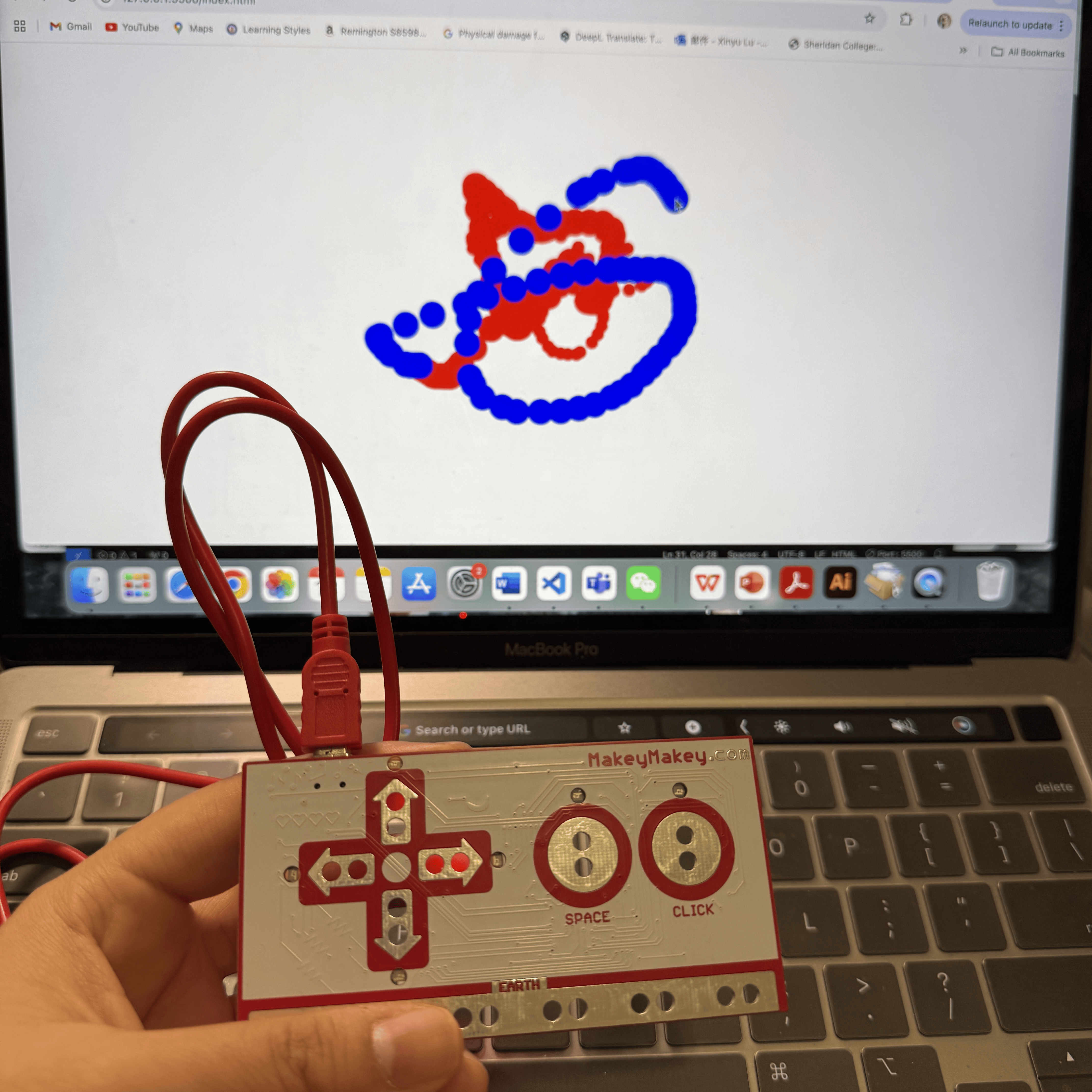 In this photo, I am using a Makey Makey device to control a drawing application displayed on my laptop screen. I drew spirals and other shapes in red and blue by pressing the arrow keys to change the direction and color of the brush.