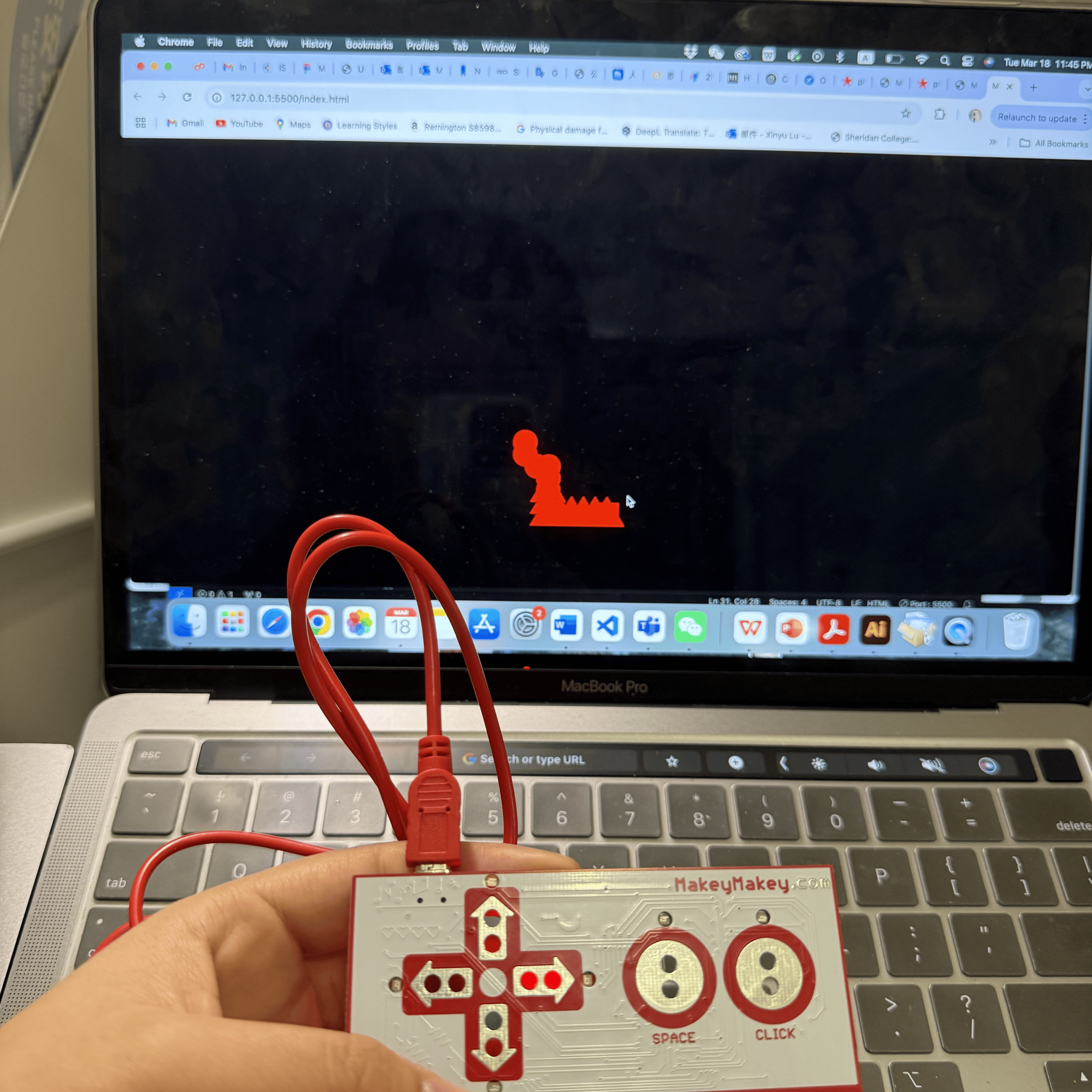 In this photo, I'm using my laptop to run an interactive p5.js sketch that displays different geometric shapes on the screen. As I press keys, the shapes switch between a rectangle, a triangle, and an ellipse, each in a different color.